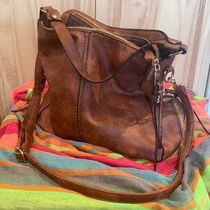 Brown purse with shoulder strap, and hand strap. Lots of storage.